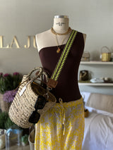 Straw bag with colored shoulder strap